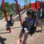 Amara and Jojo hit the swings