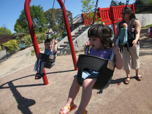 Amara and Jojo hit the swings